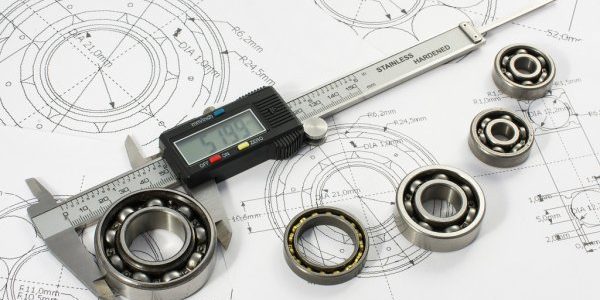 depositphotos_94113080-stock-photo-bearing-and-caliper-on-the